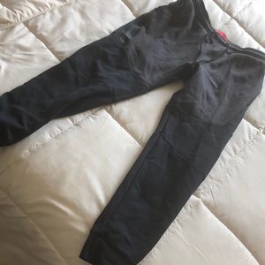 Black and grey Nike tech sweatpants